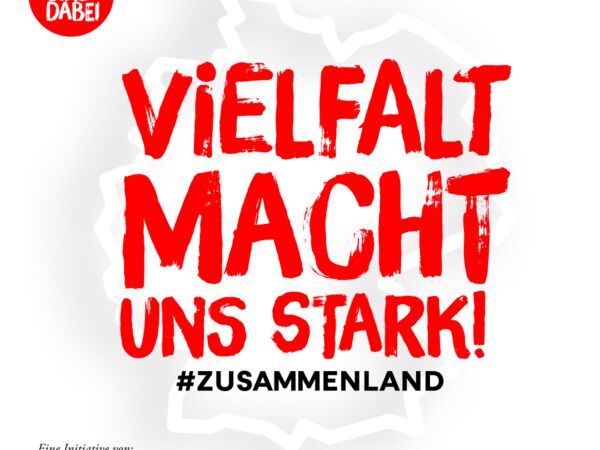 Das Foto zeigt das Logo der Kampagne #zusammenland.